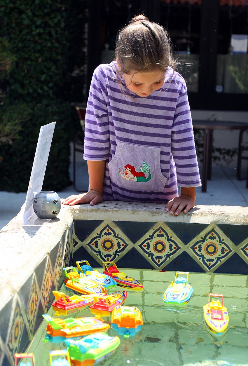 Elizabeth Fushen takes her time choosing a prize boat during National Marina Day Saturday, June 11 at Longboat Key Club's Marina.
