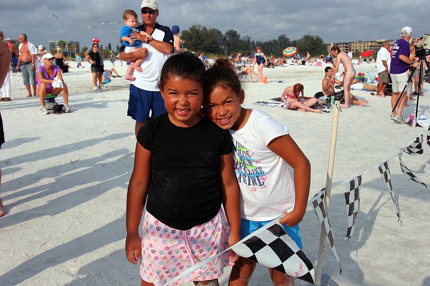 Huntar, 6, and Dakota, 8, Salem pose together before running in the 1-mile fun run Tuesday, June 14 on Siesta Key Beach.
