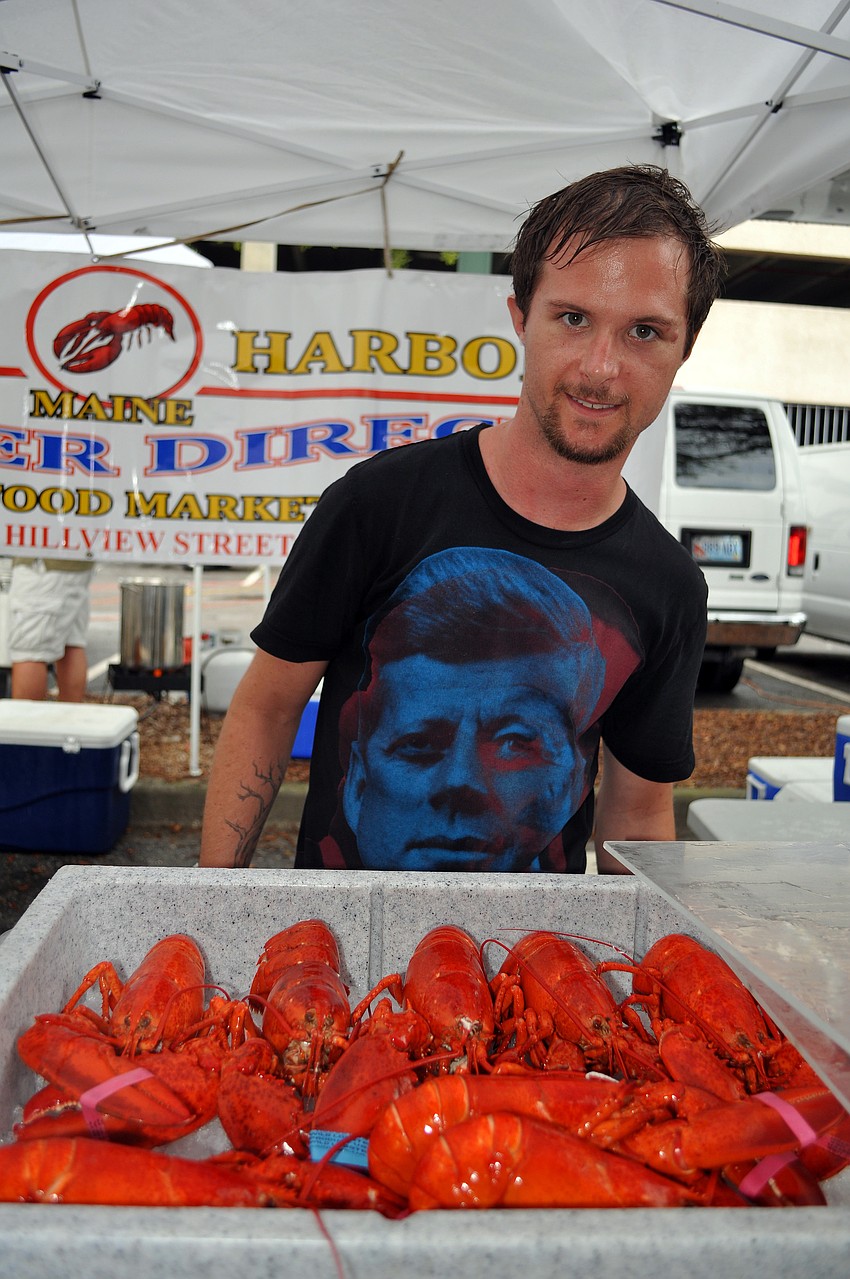 Doug Mahan stands behind a cooler full of lobsters Saturday, July 2 at the Sarasota Farmers Market first ever Shrimp and Lobster Festival.