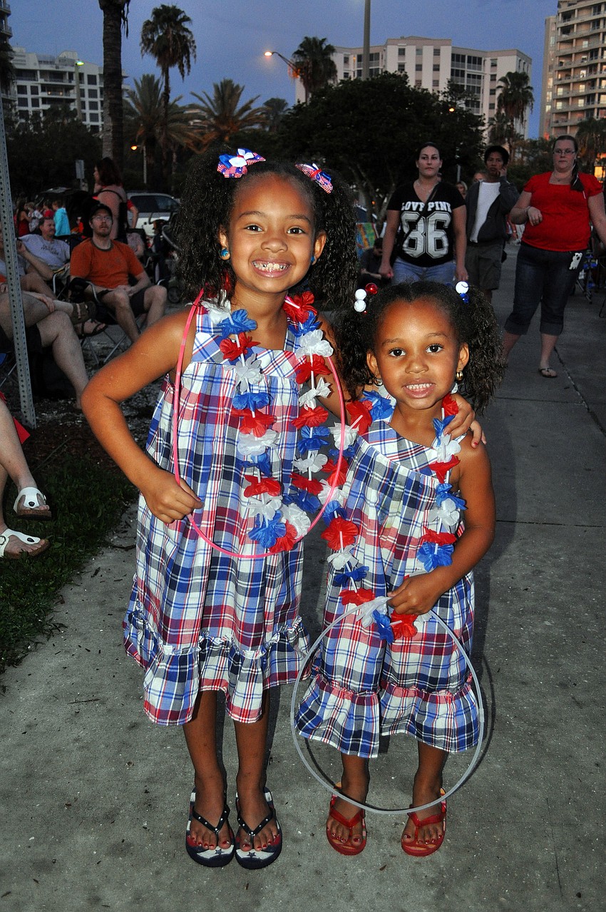 Trimirah, 6, and Nevaeh, 4, Taylor pose in their matching dresses Monday, July 4 prior to the Bayfront Fireworks Spectacular.