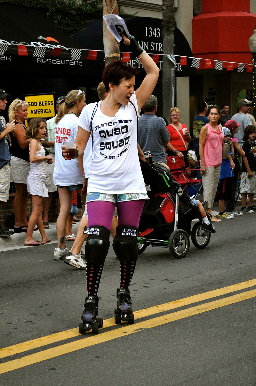 A member of the Quad Squad roller skates through the parade.