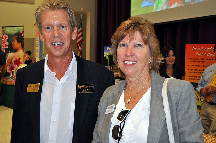 Bob Hite, of Larry Allan, and Kathy Collums, of Sabal Palm Bank.