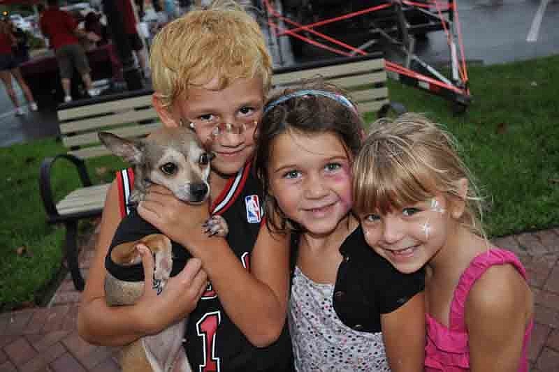 Eli and Chesnee Dralus and their friend Katelyn Sanders couldn't resist bringing their dog, Louise.