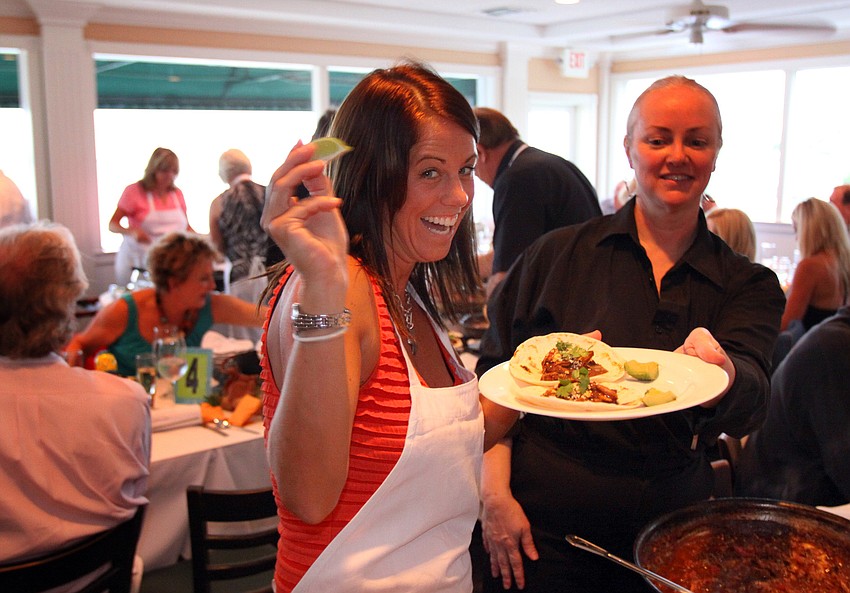 Brooke Hann shows off a lime she plans on squeezing onto the dish she created Friday, July 22 during the Interactive Mexico dinner at Pattigeorgeâ€™s.