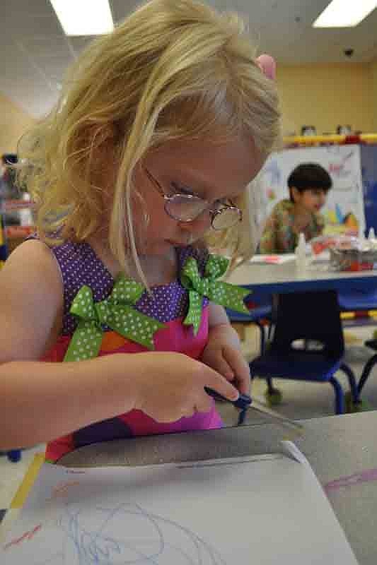 Marin Eige, 3, added created a special border for her drawing.