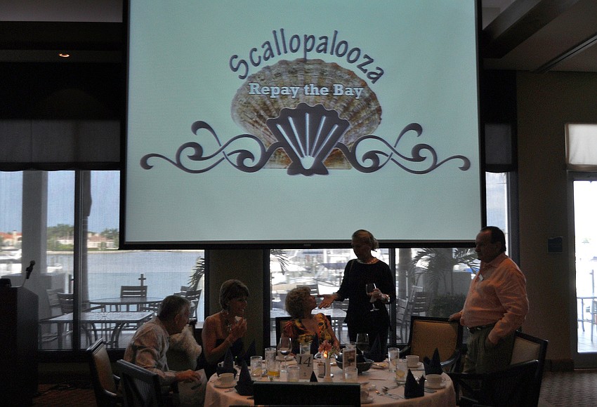 The dining room was set up with two large screens for the presentation and dinner portion of the event.