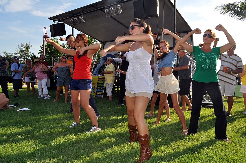 The members of the flash mob performed during a break between sets Friday, August 12 during Friday Fest at the Van Wezel.