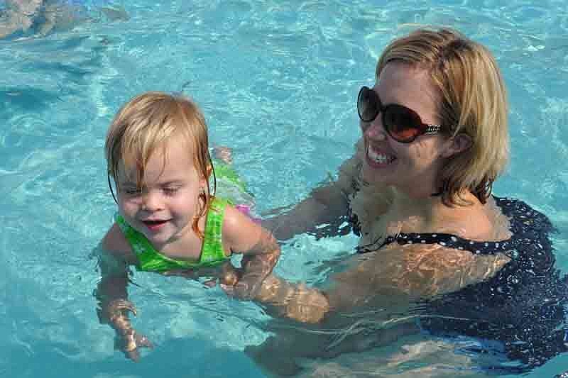 Charlotte Hommez, 1, practices swimming with her mom, Keri.