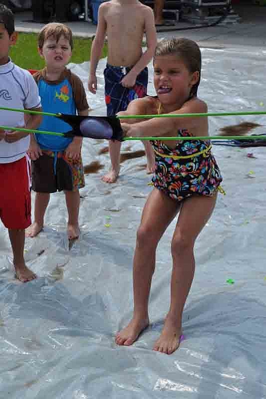 Jenna Santiago, 7, pulled with all her might.