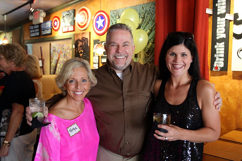 Kathye Faries poses with Steve and Kelly Evens