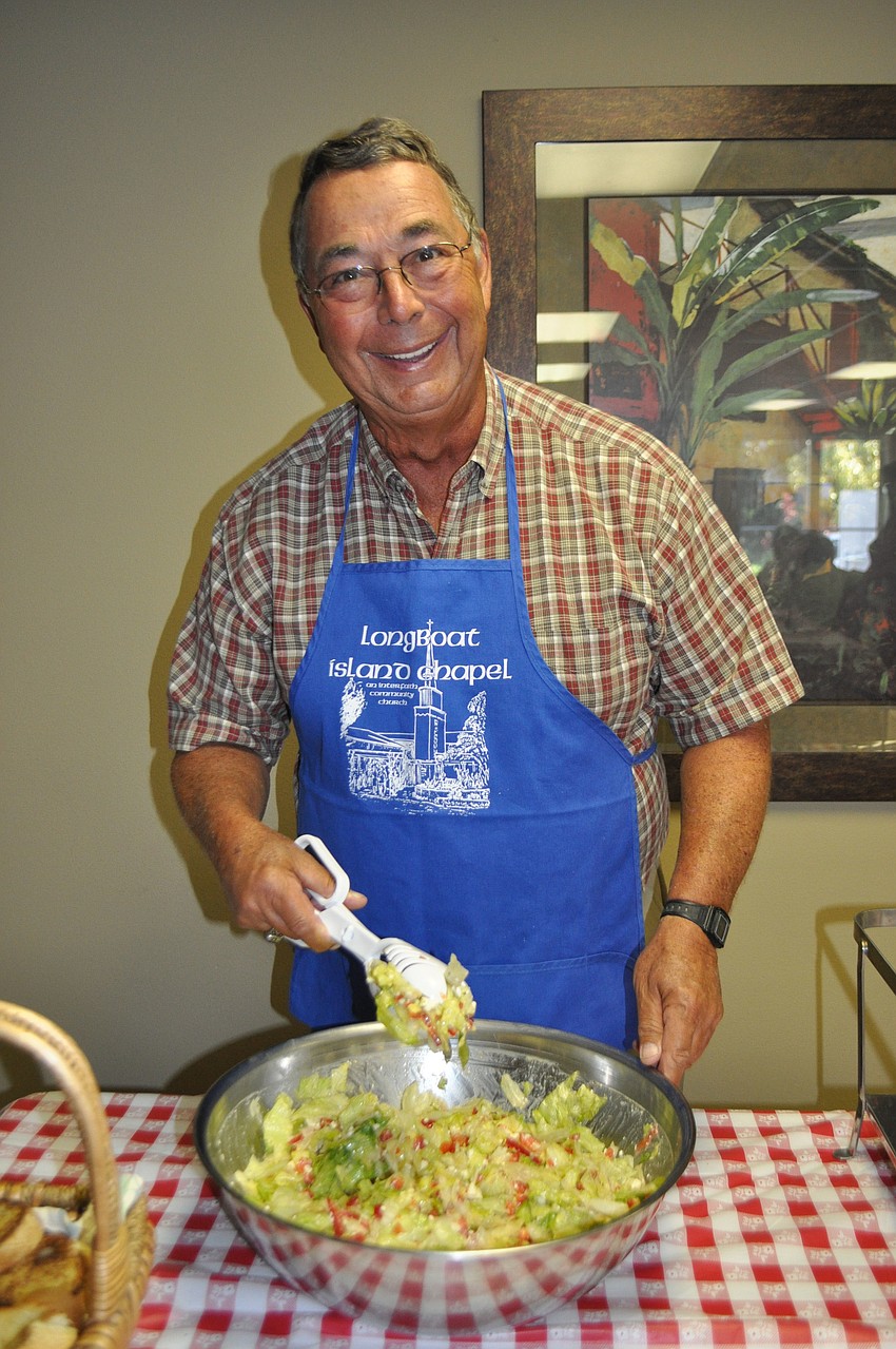 Art Tankersley serves up salad.