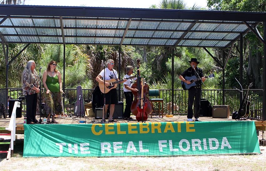 A band plays during the Earth Day Celebration on Sunday, April 17 out at Oscar Scherer State Park in Osprey. Redhead and Shedlock also had catepillars painted across their noses and named their new friend 