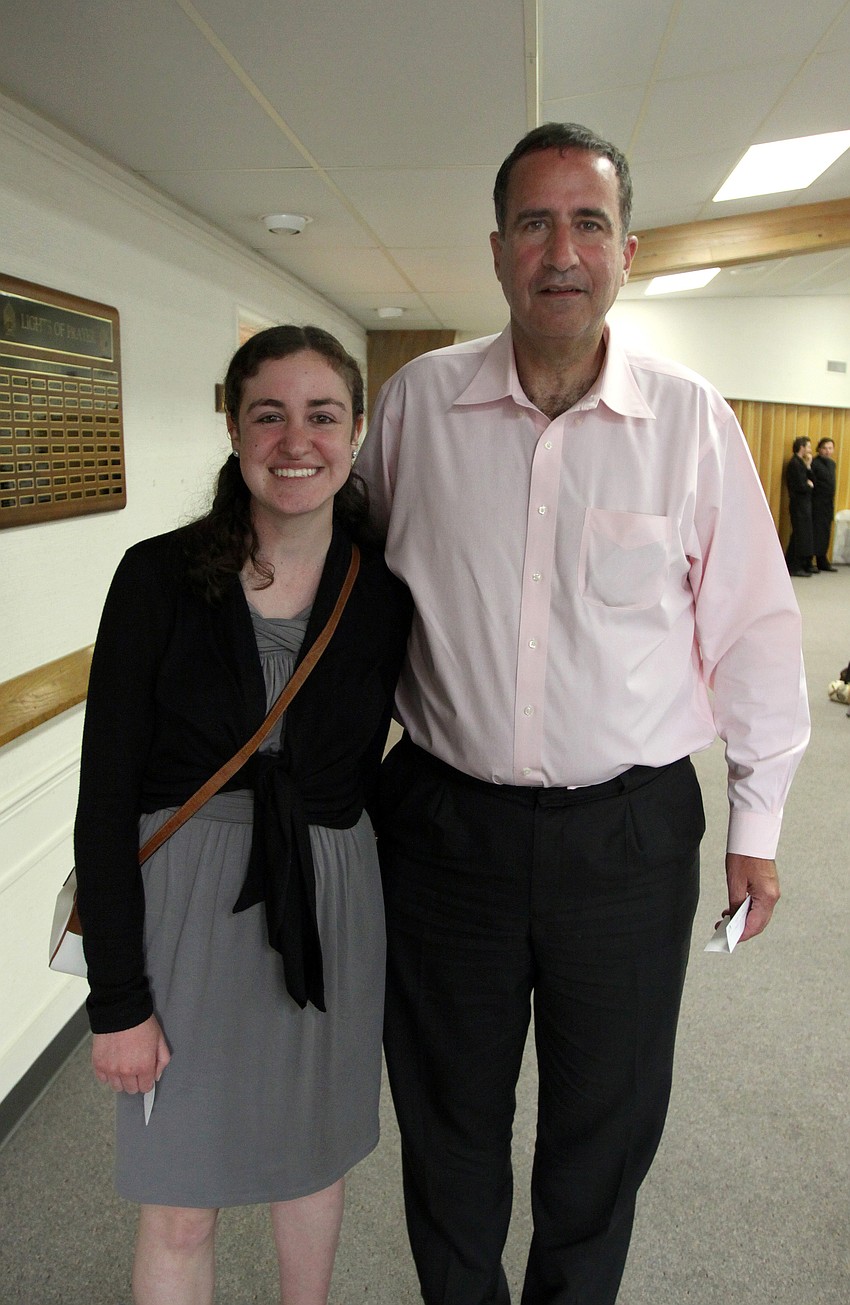 Anna and Sam Lippe make their way to their table on Monday, April 18 at Temple Emanu-El's Seder dinner.