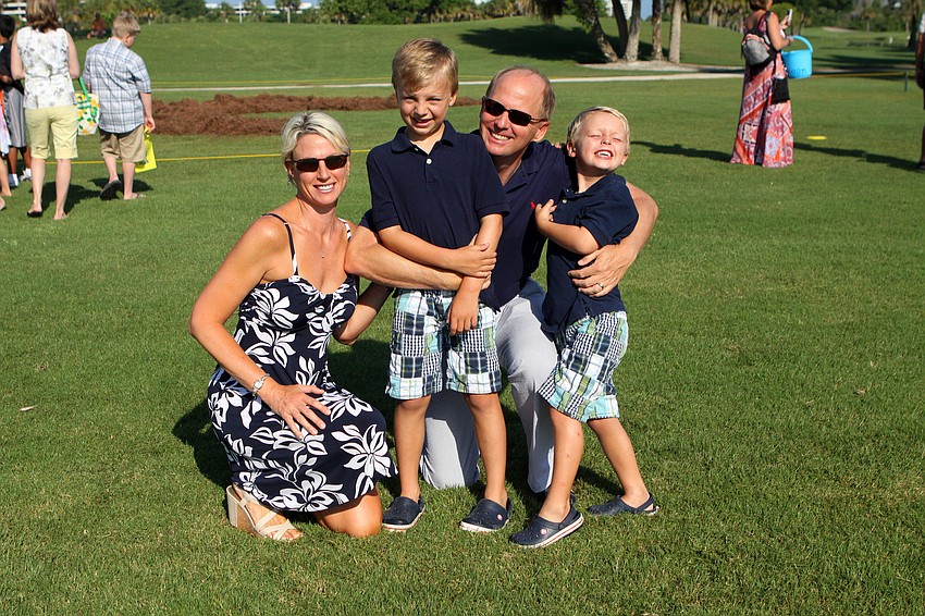 Alisa, Jake, Roger and Max Pettingell have a good time together at the Longboat Key Club Easter egg hunt.