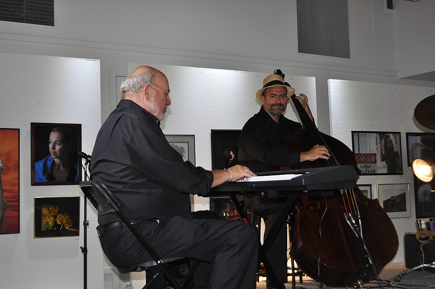Dick Reynolds and Billy Pillucere play for the crowd.
