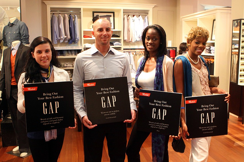 Gap models Kelsey Ward, Chris Blanchard, Torri Thomas and Myca King strike a pose inside Banana Republic Thursday, April 28 during the Paint the Town Blue event at Westfield Southgate.