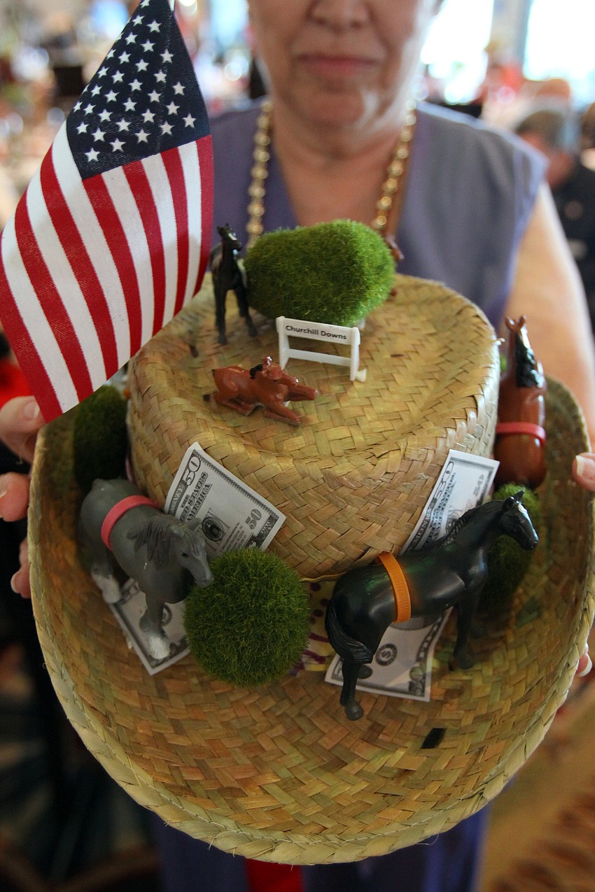 Sharon Miller shows off her homemade hat that won her 