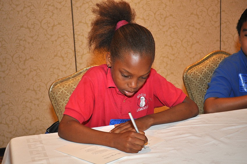 Doneshia Thomas fills completes an activity on good manners.