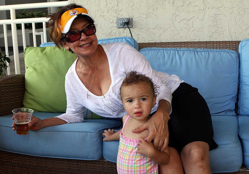 Linda Kunder enjoys some time with her niece, Sophia, at the Longboat Key Club's BBQ and Movie night Saturday, May 28 at the Longboat Key Club hotel poolside.