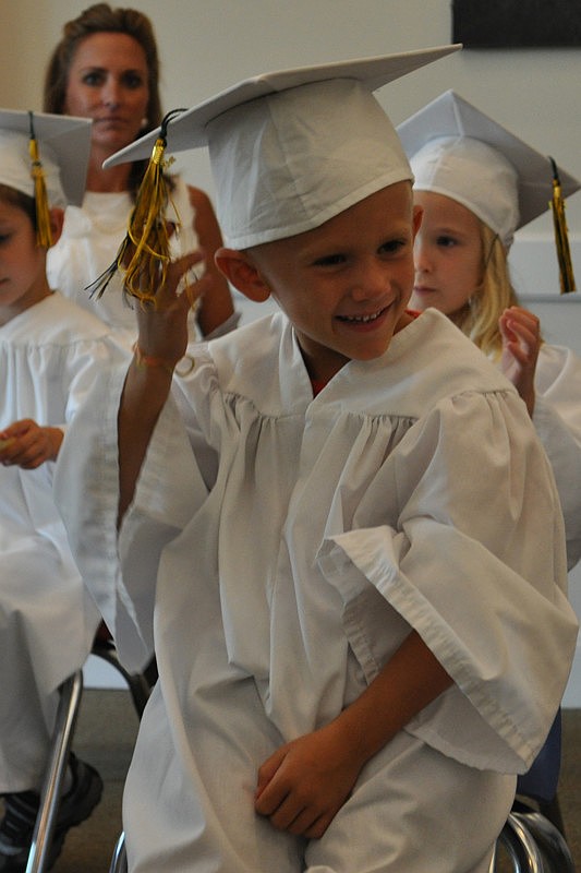 TJ Stone couldn't resist playing with his tassel during the ceremony.
