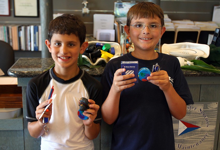 Frankie, 8, and Sammie, 10, Storti show off what they chose as their prizes during National Marina Day Saturday, June 11 at Longboat Key Club's Marina.