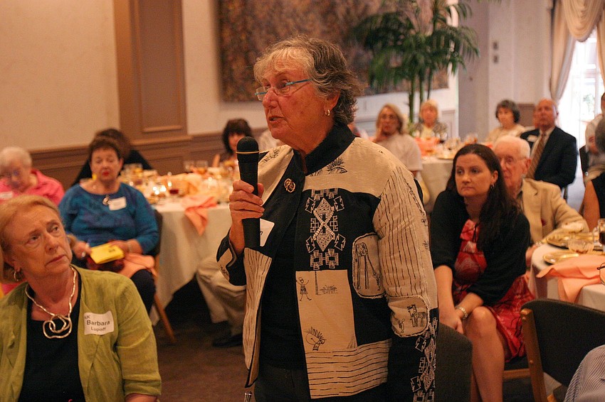Susan Johnson asks a question during the Q&A portion of AJC's Lunch and Lecture Wednesday, June 15 at Michael's on East.