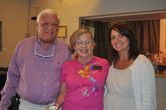 Commissioner Lynn Larson, center, with David and Lucy Miller, of Cannons Marina