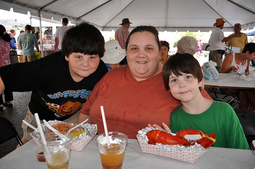 Meghan Olsson poses with her sons Brodie, 11, and Liam, 7, at the Sarasota Farmers Market first ever Shrimp and Lobster Festival.