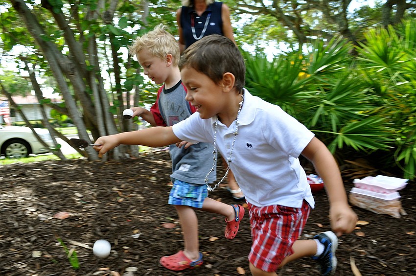 Liam Devine and Zachary Campbell compete in the egg-spoon race.