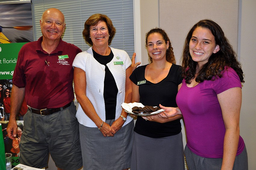 Mr. Lang, Susan R. Stewart, Julie Krueger and Laurabeth Goldsmith pose together at their table promoting the Girl Scouts of Gulfcoast Florida Wednesday, July 13 at Sarasota Prime Time.