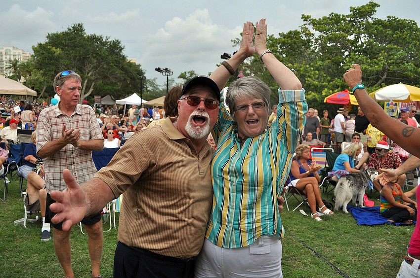 Chris and Ginger Harding strike a pose at the end of a song Friday, July 15 at Friday Fest at the Van Wezel.