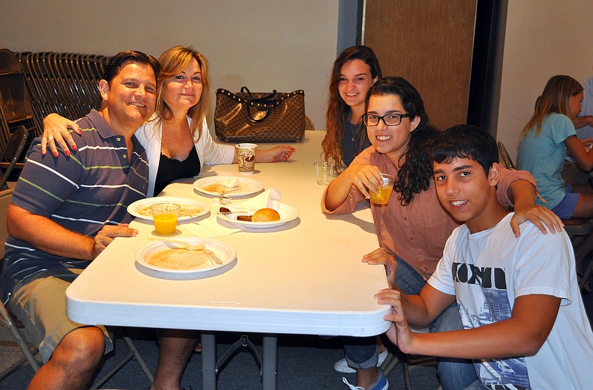 Jorge Costales, Nora Galego, Nicole Galego, Gabrielle Costales and Danny Costales pose together at the pancake breakfast put on by the Knights of Columbus Sunday, July 17 at St. Michael the Archangel Catholic Church.