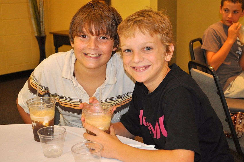 Jesse Rollins, 11, and Ian McLean, 11, pose with their root beer floats.