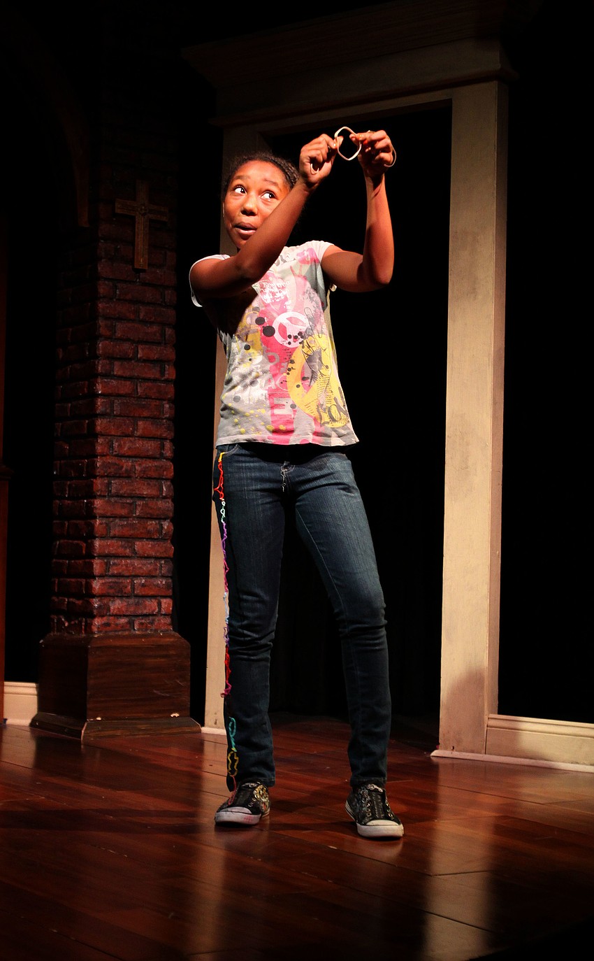 Amara Merritt shows off one of her â€œBland Bandzâ€, one of her monologues, during dress rehearsal Thursday, Aug. 18 at Florida Studio Theatre.