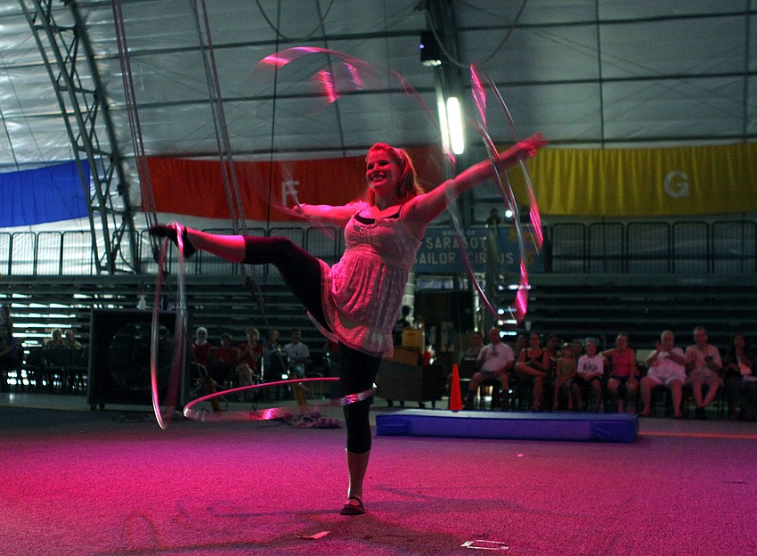 Aerial Emery of Xelias Aerial Arts in Minneapolis, MN shows off her hula hooping skills during American Youth Circus Organizationâ€™s showcase performance Thursday, Aug. 18 inside the PAL Sailor Circus Arena.