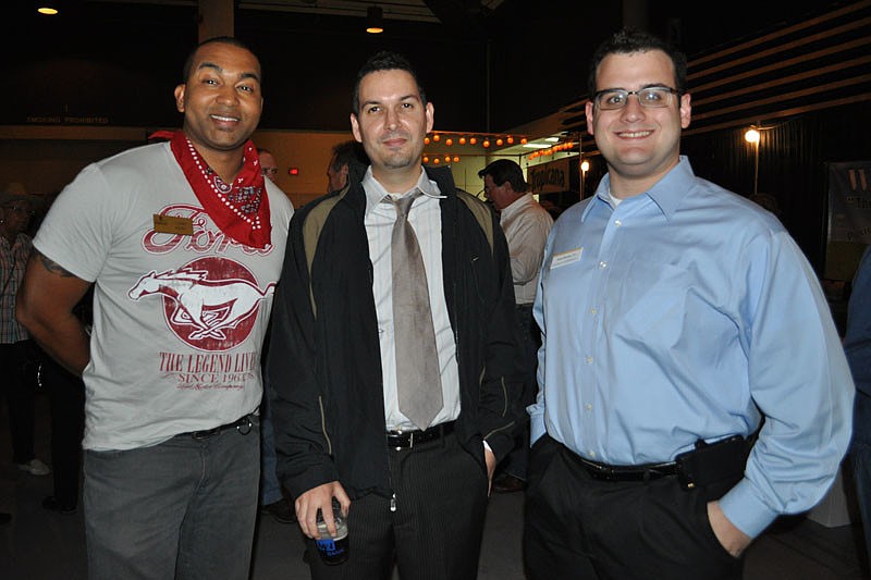 Jason Russ of Whitney Bank with Noah Chai and Josh Bloom, both of Shinn & Co.
