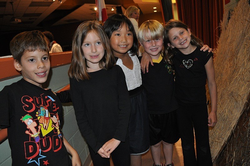 First grade students Timur Malkoc, Hannah Newman, Emily Poulton, Christian Vannan and Hailey Lord served as the stage crew.