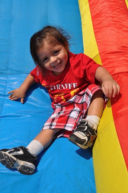 Luis Martinez, 1, could not get enough of the inflatable slide.