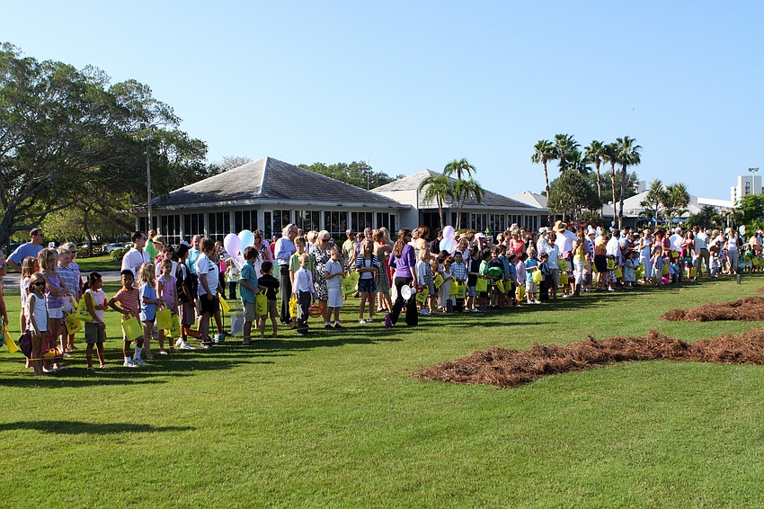 Kids lined up by age group and waited to begin searching for Easter eggs Sunday, April 24 at Longboat Key Club.