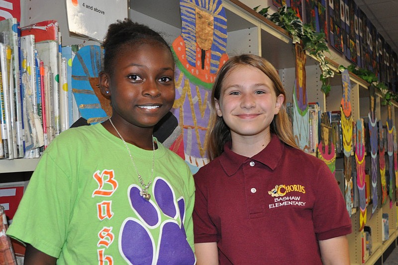 Essence Key and Grace Rogers checked out student artwork.