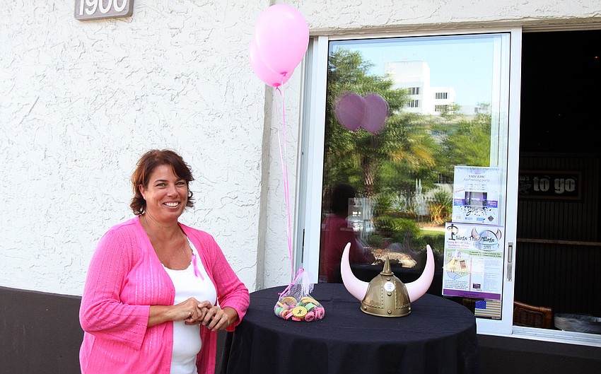 Team member Terri Turcotte was in charge of the table outside of Gecko's as part of Pillage the Village fundraising event Friday, May 6 at various locations throughout Southside Village.