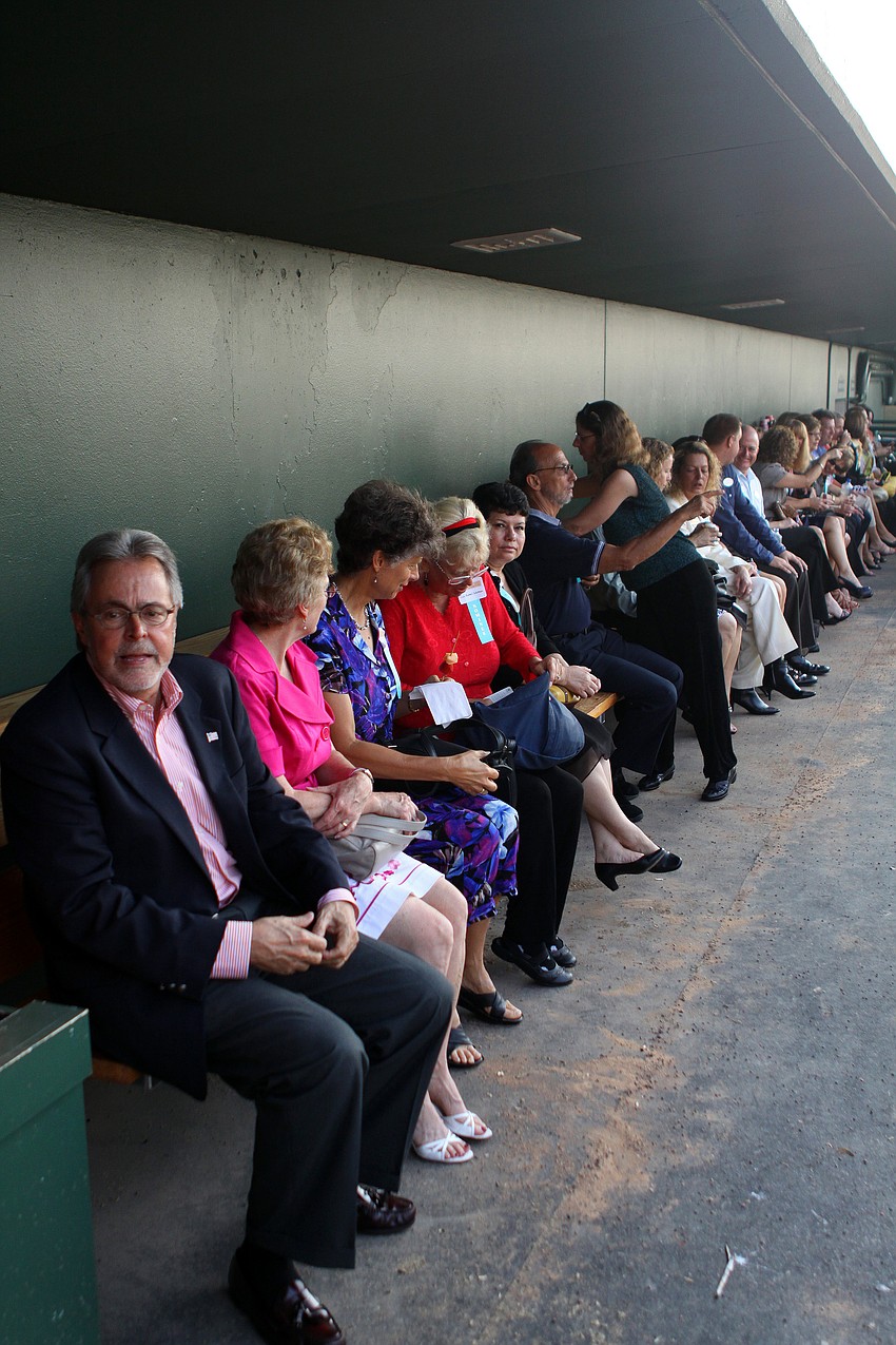 The nominees sit in the visitor's dugout prior to the 2011 National Tourism Week Awards ceremony Thursday, May 12, at Ed Smith Stadium.