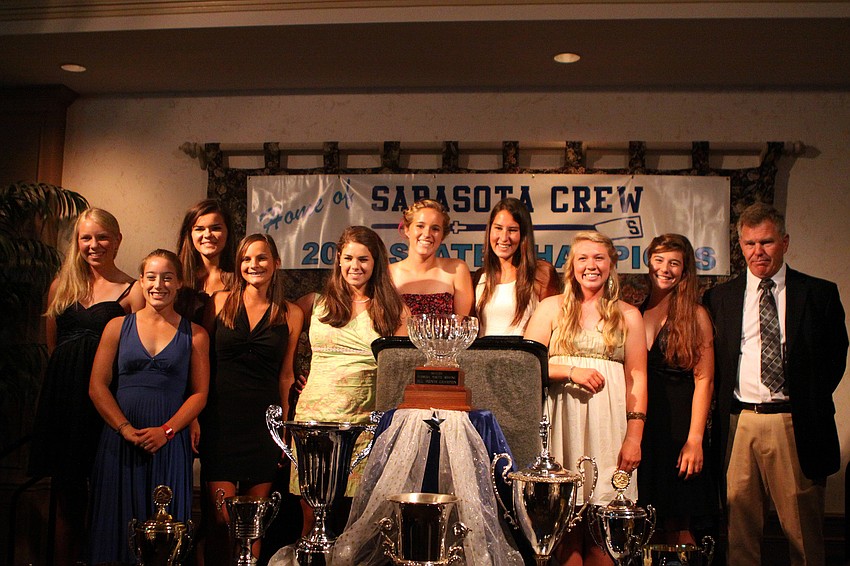 The girls going to Nationals pose with their coach, Marty Beyer, at Sarasota Crew's Night of The Stars Sunday, May 22 at Michael's on East.