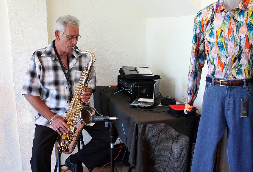 Bob Moffitt played the saxophone Friday, June 3 during Taffy's grand opening at his new store front on St. Armands.