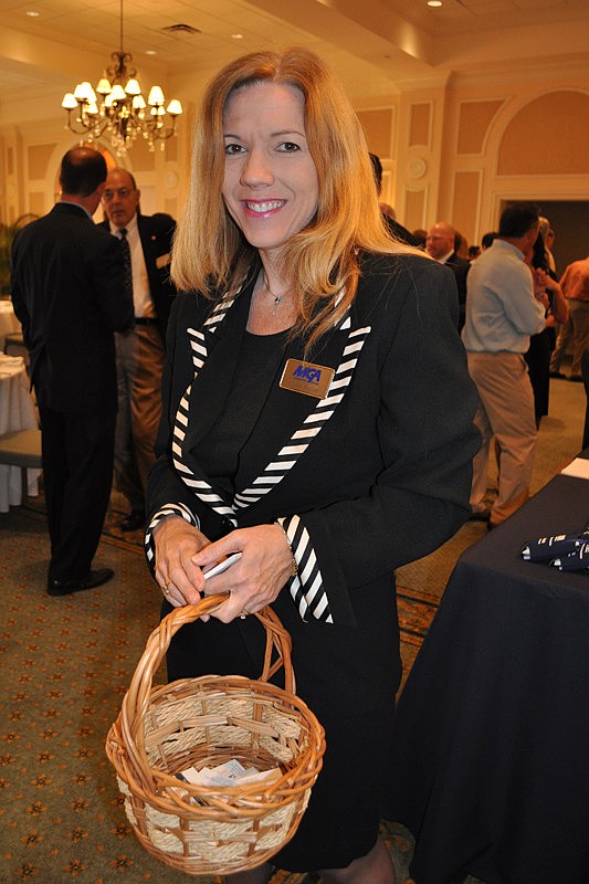 MGA Insurance's Darlene Williams collected business cards from guests as they arrived.