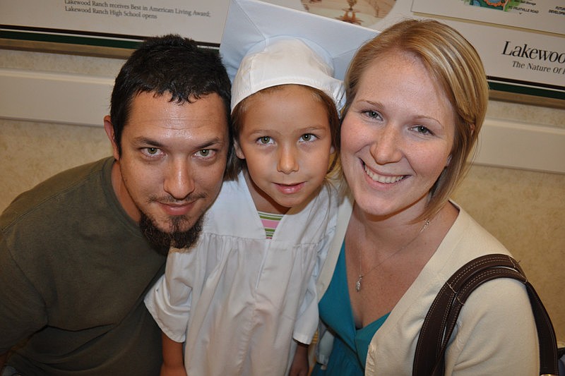 Pictured are Brian and Kelly Vazquez with their graduate, Lily.