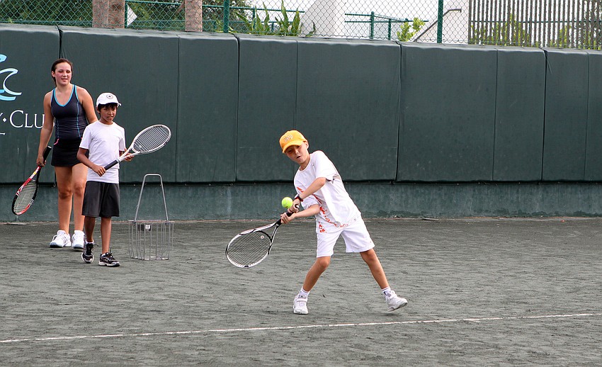 Quinn Isaac, 8, prepares to hit a forehand during Longboat Key Club's Tennis Camp Monday, June 6 at Longboat Key Club's Tennis Gardens.