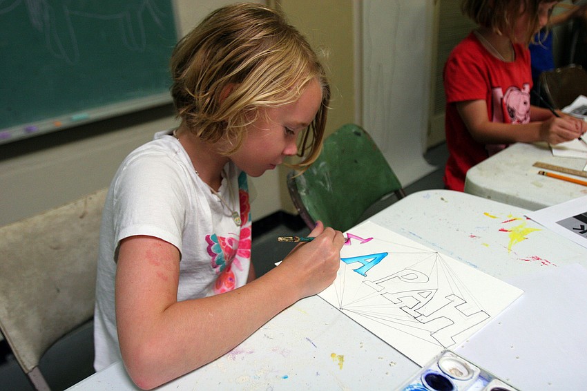 Sarah Lowery, 9, paints in her Greek 
