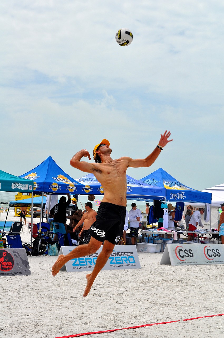 Steve Grotowski serves the ball Saturday, July 9 at Siesta Key Beach.