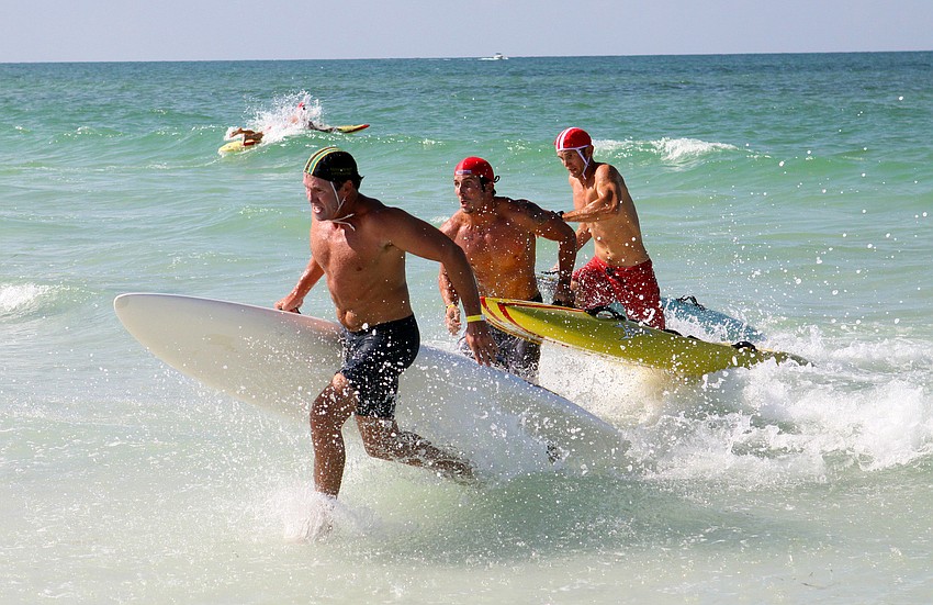 It was a close call between three of the lifeguards in the menâ€™s rescue board race Thursday, July 14 during the 2011 James 